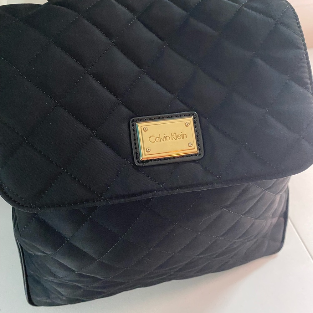 Calvin Klein versatile pocketbook/backpack, pockets, lite, straps & handle.